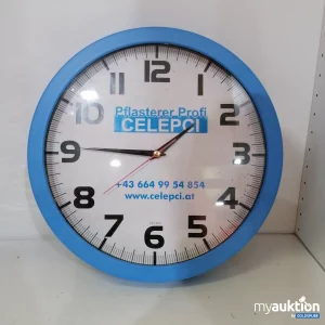 Auktion Blaue Wanduhr mit Logo